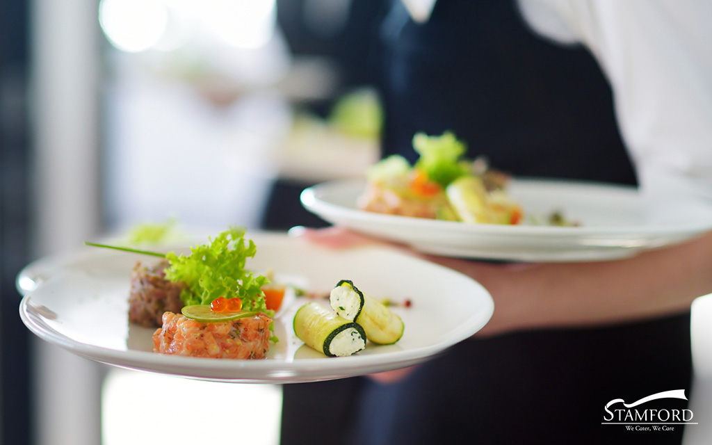 Plates of food to serve guests at a wedding