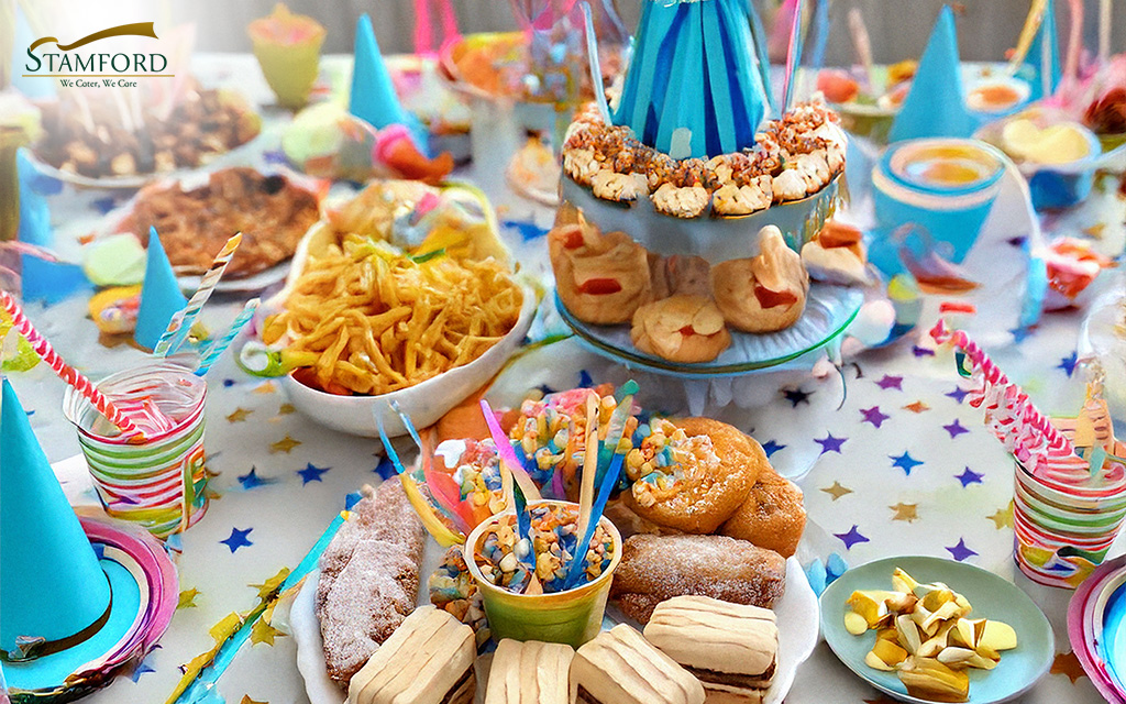 Assorted snacks and desserts at a themed kids' party.