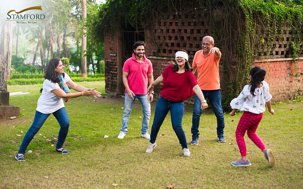 Family playing games at a Stamford BBQ party.