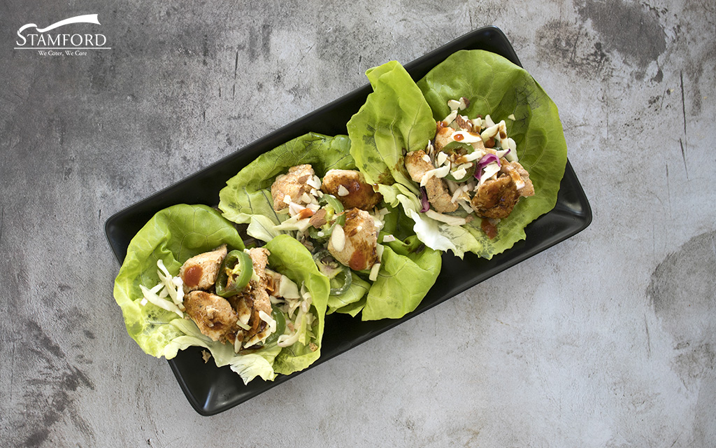 Chicken lettuce wraps, a fusion dining experience.