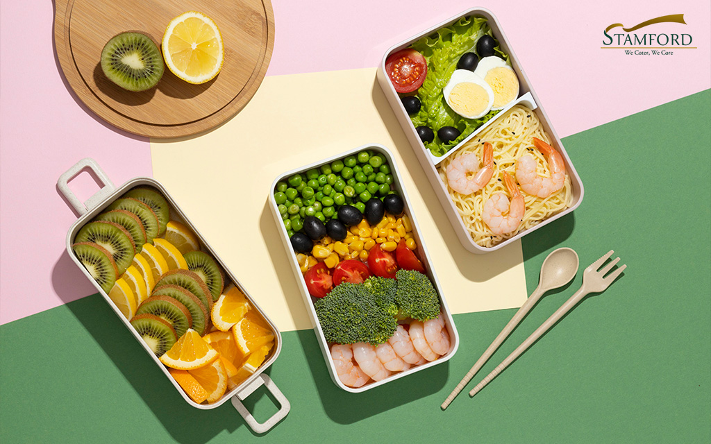 Creative bento boxes with healthy corporate lunches.