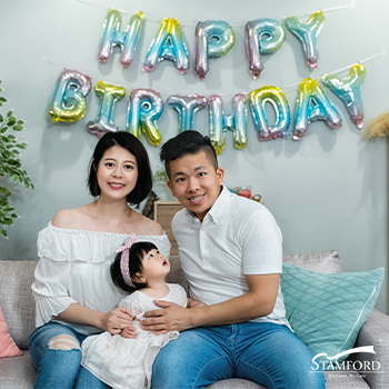 Family celebrating baby's first month at home.