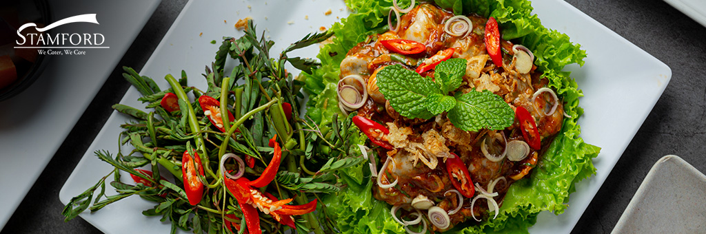 Spicy Asian salad with herbs for unique dining.